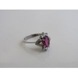 18ct white gold ring with centre ruby & 8 diamond surround, by Stern Jewellers (numbered), size N,