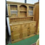 Pine dresser with 2 glazed cupboards flanking shelved alcove over 3 drawers & 3 cupboards, 154 x