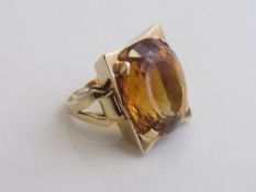 18ct gold ring with a large orange stone (size of stone 2.2mm to 1.8mm), weight 18gms. Estimate £1,