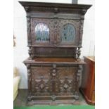 Large ornately carved continental dresser/cabinet with 2 stained glass fronted doors to cabinet over