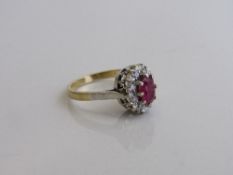 18ct gold, platinum, ruby & diamond cluster ring, size O, weight 4.3gms. Estimate £600-650
