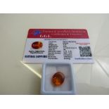 Oval cut orange sapphire, weight 9.40ct with certificate. Estimate £40-50