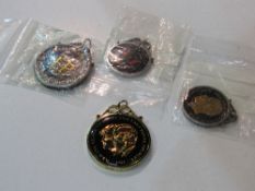 4 enamelled British & American coins all in sterling silver mounts. Estimate £20-30