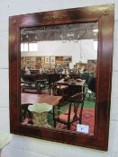 Ornate Regency-style figured mahogany wall mirror with twin inlays of boxwood stringing & faux