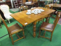 Oak draw-leaf dining table on turned legs, t/w 4 matching rail back chairs, 153 (open) x 88 x 77cms.