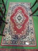 Red ground rug, 153 x 80cms. Estimate £25-35