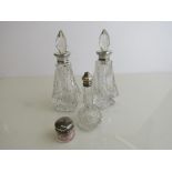 Pair of cut glass silver rim bottles with stoppers, London 1927 (1 stopper a/f); small silver lidded