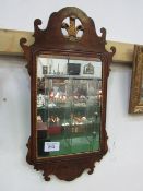 Mahogany Chippendale-style wall mirror. Estimate £20-30