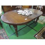 Edwardian mahogany wind-out dining table complete with 2 leaves, reeded turned legs to casters,