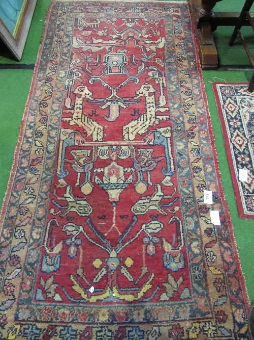 Red ground Middle-Eastern runner, 106 x 103cms. Estimate £20-30