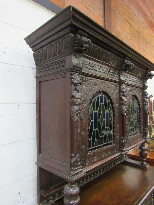 Large ornately carved continental dresser/cabinet with 2 stained glass fronted doors to cabinet over - Image 9 of 11