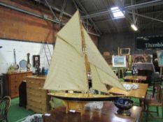 Varnished wood pond yacht with sails & on a stand, height 118cms, length 115cms. Estimate £80-120