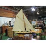 Varnished wood pond yacht with sails & on a stand, height 118cms, length 115cms. Estimate £80-120