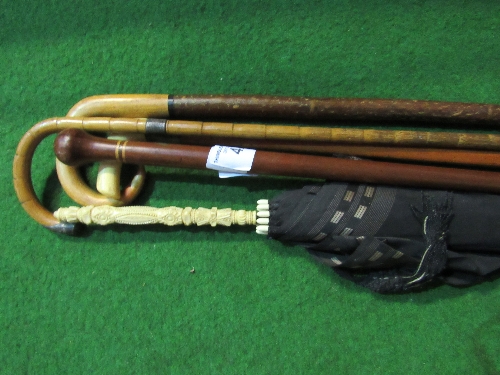 Ivory handled parasol; bone handled walking stick with silver ferrule; walking cane with silver