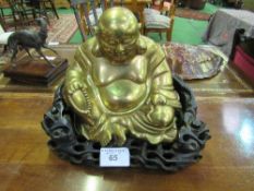 Brass Buddha on carved wooden base, height 32cms, width 40cms. Estimate £100-120