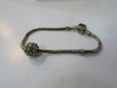Unusual Pandora bracelet in box with large charm. Est 20-30