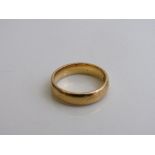 22ct gold band size L weight 5.9gms. Est £160-180