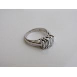 14ct white gold 3 stone trap cut diamond ring. Estimate £2,000-2,100