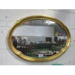 Gilt framed shaped oval wall mirror, 61 x 92cms. Estimate £20-30