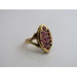 18ct gold oval shaped ring with a setting of red stones, weight 5.1gms size L. Est £130-150