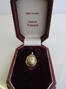 Gold on silver egg shaped locket pendant by Sarah Faberge in original case. Estimate £20-30