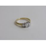 18ct gold & 3 stone diamond ring. Diamonds, emerald cut 1ct total, colour G, clarity VS. Size N 1/2.