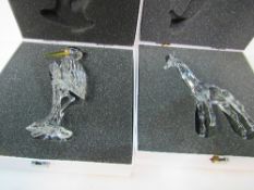 Swarovski heron, boxed together with a giraffe, boxed. Estimate £50-60