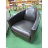 Brown leather-effect Aviator shaped armchair, 68 x 90 x 70cms. Estimate £50-60