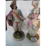 A pair of Continental porcelain figures, male & female, in 17th century costume, male figure has