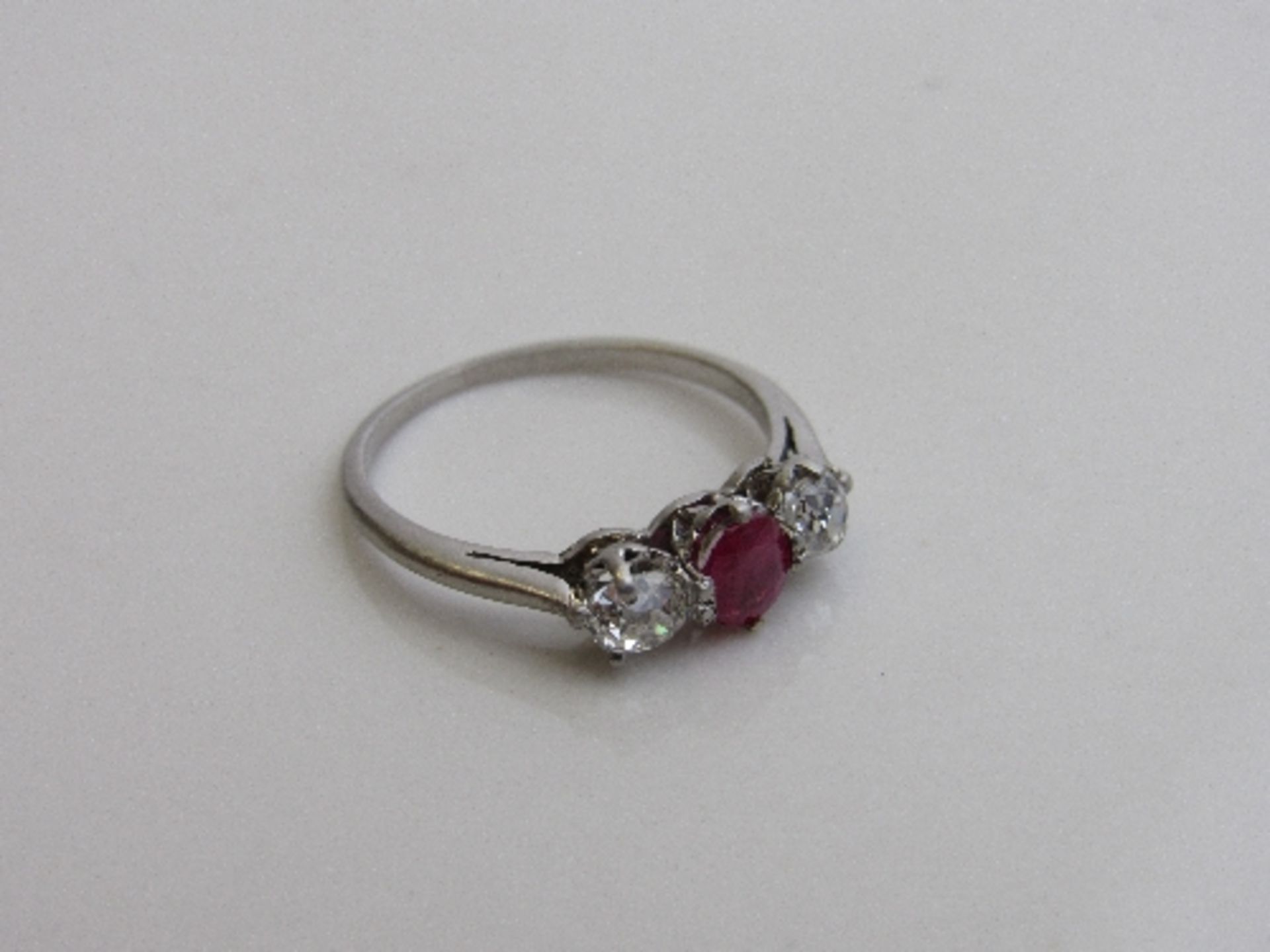 Platinum, diamond & ruby ring, size J 1/2, weight 2.3gms. Estimate £450-480