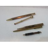 Victorian gold plated purse pencil, plus 4 other vintage pencils. Estimate £15-25