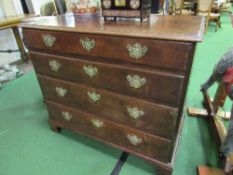 Georgian oak chest of 4 graduated drawers with ornate brass handles & escutcheons on bracket feet,