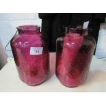 2 purple glass large candle holders. Estimate £20-30
