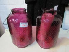 2 purple glass large candle holders. Estimate £20-30