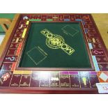 Franklin Mint 'Collector's Edition' traditional Monopoly set (glass top missing). Estimate £100-150