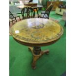 Walnut veneer circular table with inlaid medallion on pedestal to 3 feet, diameter 70cms.