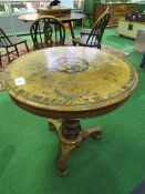 Walnut veneer circular table with inlaid medallion on pedestal to 3 feet, diameter 70cms.