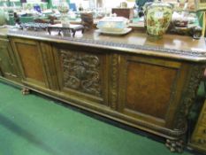 Continental mahogany long sideboard with upstand, carved centre door flanked by cupboards, 200 x