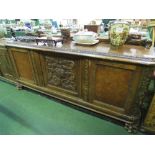 Continental mahogany long sideboard with upstand, carved centre door flanked by cupboards, 200 x