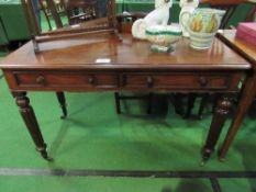 Mahogany library table with 2 frieze drawers, reeded legs to casters, 120 x 57 x 75cms. Estimate £