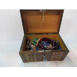 Carved wooden box containing semi-precious stone set jewellery. Estimate £15-25