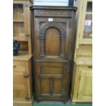 Oak corner cabinet with carved decoration to top cupboard, 70 x 38 x 176cms. Estimate £20-30