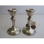 Pair of silver hallmarked candlesticks, Birmingham 1979, height 11cms. Estimate £40-60