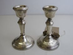 Pair of silver hallmarked candlesticks, Birmingham 1979, height 11cms. Estimate £40-60