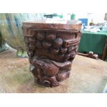 Chinese bamboo brush pot (bitong) carved with a resting deity, height 19cms. Estimate £20-30
