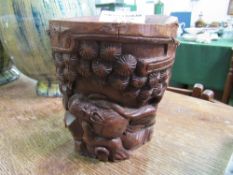 Chinese bamboo brush pot (bitong) carved with a resting deity, height 19cms. Estimate £20-30