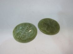 2 jade plaques, diameter 6cms. Estimate £30-50
