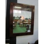 Ornate Regency-style figured mahogany wall mirror with twin inlays of boxwood stringing & faux