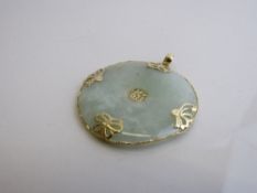 14ct gold mounted circular jade pendant. Est £30-50