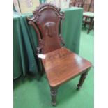 Mid-Victorian ornately carved dark oak hall chair. Estimate £40-50